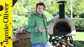 Jamie Oliver shows you how to cook pizza in a wood fired oven