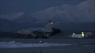 Fighter-interceptors MiG-31 in the night sky over Kamchatka and the waters of the Pacific Ocean