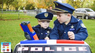 Little Heroes search for their pretend play police gear
