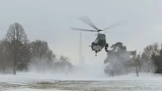 Raw: Marine One Blows Snow on Photojournalists