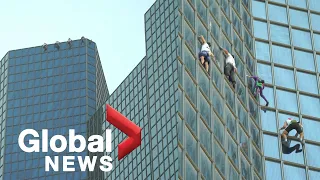 French Spiderman, “Three Musketeers” climb skyscraper