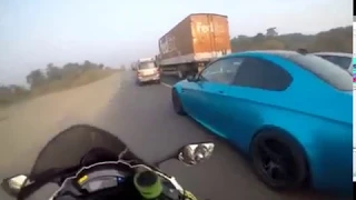 BMW M3 sportscar & Kawasaki ZX10R street racing on an Indian highway