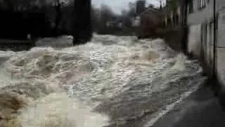 Ingleton River Greta in torrential flood waterfalls