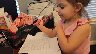 Aubrey practicing writing her name