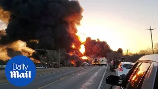 Smoke and flames billow from crash between semi truck and oil train in Cameron, Texas