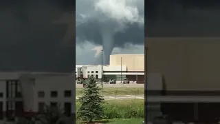 Woman Witnesses Tornado Behind Building - 1143584