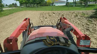 Using my RK 55 tractor to rototill what I have plowed for my sweetcorn.