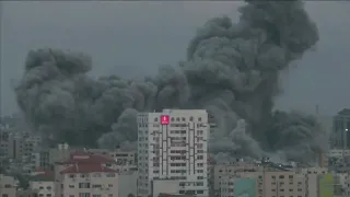 Building collapses in Gaza City after Israeli air strike