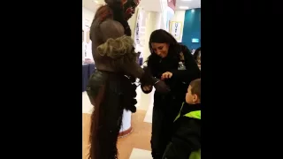 Former WWE Superstar The Boogeyman giving his bracelet to a boy