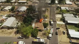 Fire crews battle northwest Phoenix home in flames