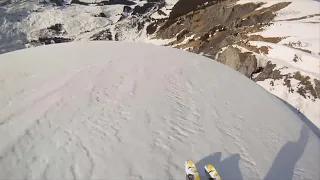 Skier falls off cliff...