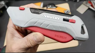 Squeeze: Aluminum Husky utility knife with auto retraction, depth settings, lock, and blade storage.