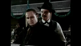 Marlon Brando takes a whipping from Karl Malden like a man