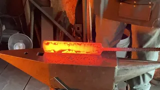 Forge welding a stainless steel san mai billet.