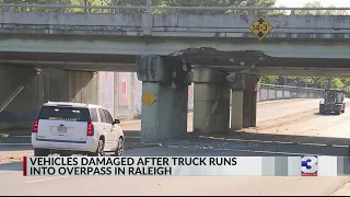 Vehicles damaged after truck collides into overpass in Raleigh