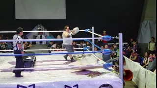 Crazy wrestling match ends with a concrete block to the head