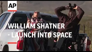 Spectators watch William Shatner launch into space