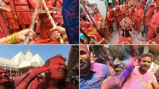 Männer kriegen wieder Schläge beim Holi-Fest in Indien