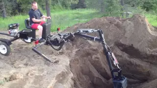 Digging the Pond with the towable backhoe