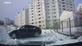 Driver Reverses Away From Sliding Car