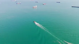 4K Free Drone Footage - Small boat sailing out to sea