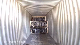 Loading an export container at Young's Auto Center and Salvage