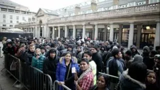 New ipad launch draws protesters lines of apple-fans