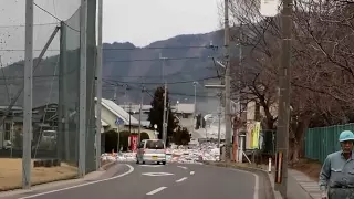 2011 Japan Tsunami: the water pouring over the seawall in Miyako [Stabilized]