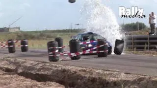 Subaru Impreza WRC P2000 hits water barrel - rally crash