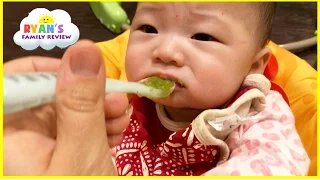 Baby First Time Eating Baby Food gross yucky Face! Twin Babies first solid food! Ryan's Family Vlog