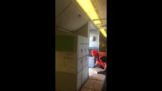 Unloading Cargo from the Passenger Cabin (seats removed) from a Boeing 777 at LAX