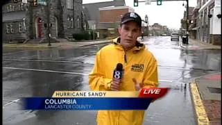 Car slides through Hurricane Sandy live shot