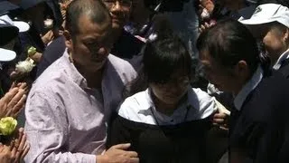 Families of Asiana flight 214 victims visit crash site