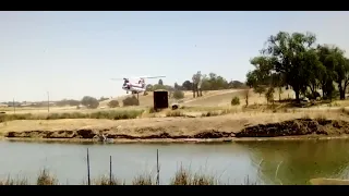 Chinook helicopter water lift to fight fire.