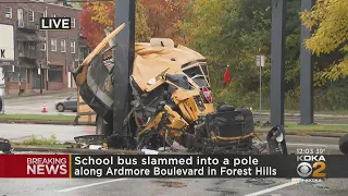 Bus torn open after slamming into pole