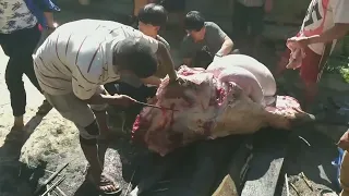 Buffalo meat cutting cooking and eating in the village of Nepal