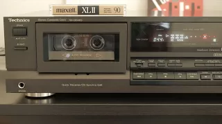 A Technics cassette deck playing Huey Lewis from a tape