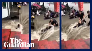 China: moment woman rescued from dangerous floodwaters in Zhengzhou