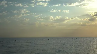 Flawless Beautiful Sunset With Clouds Over The Ocean With Buoys On The Sea Coast