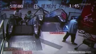 CCTV footage- Escalator swallows cleaner’s foot in China mall (Source).mp4