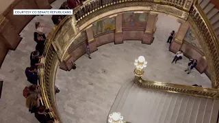 Colorado senators drop rubber band ball from rotunda