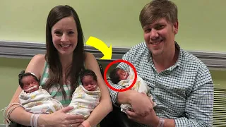 Parents pose in front of the camera with newborn triplets. But look closer at the babies’ faces