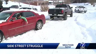 Drivers struggle on side streets due to packed snow and ice