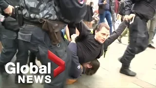 Police detain protesters in St. Petersburg, Russia as over 40,000 rally in Moscow