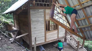 Poor girl Build LOG CABIN, Cut down trees with saw machine make open walls - Green forest farm