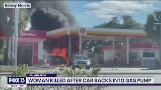 Woman killed after car backs into gas pump, starts fire