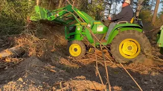 John Deere 3025e, with 300e loader clearing land for new pasture. Adams Family Homestead