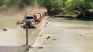 Road Train crosses Cahill’s Crossing with crocodiles watching