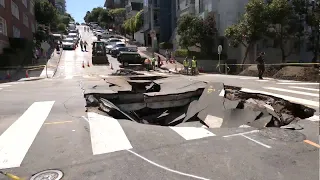 Huge sinkhole forms following water main break