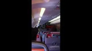 Lady Goes Crazy on Plane screaming bomb and cops escort her out